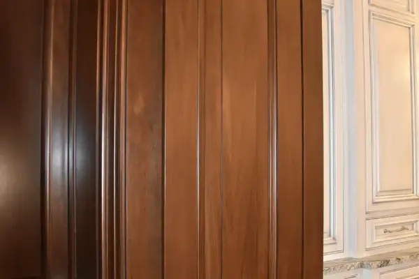 All of the doors and panels were wood grain faux finished to match the real walnut in the rest of the room
