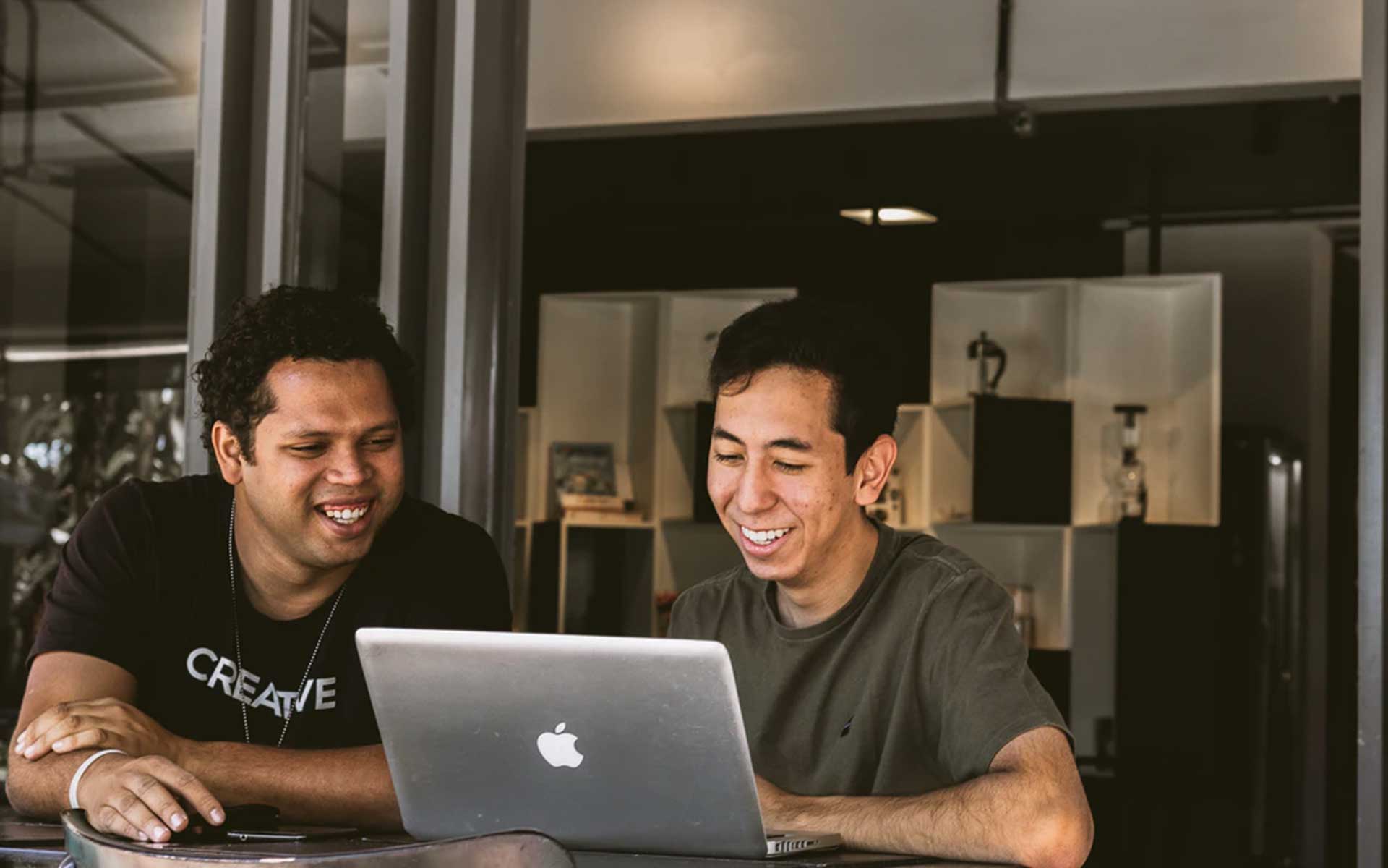 Two men looking at portfolio